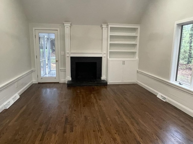 47 Woodcock Ln, Marlborough, MA 01752 - unfurnished living room with a fireplace, dark wood-style flooring, baseboards, and lofted ceiling