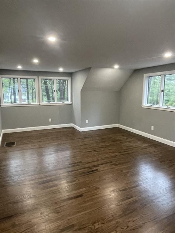 47 Woodcock Ln, Marlborough, MA 01752 - additional living space featuring dark wood-type flooring, baseboards, recessed lighting, and vaulted ceiling