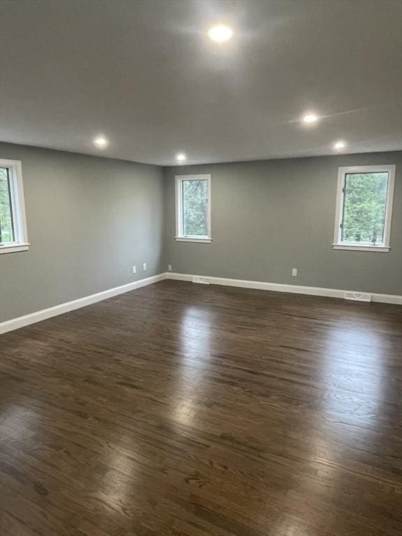 47 Woodcock Ln, Marlborough, MA 01752 - spare room with dark wood-style flooring, plenty of natural light, baseboards, and recessed lighting