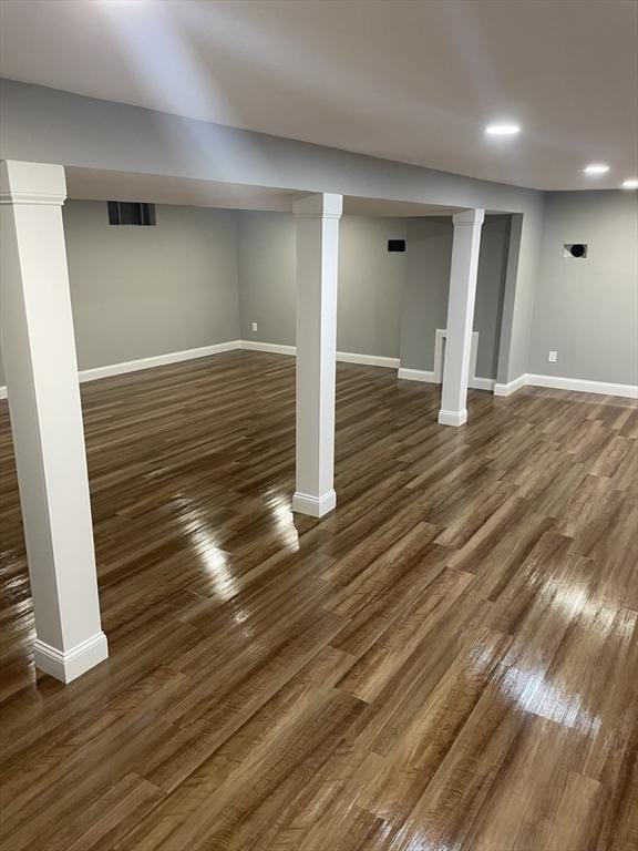 47 Woodcock Ln, Marlborough, MA 01752 - finished below grade area with baseboards, dark wood-style floors, and recessed lighting