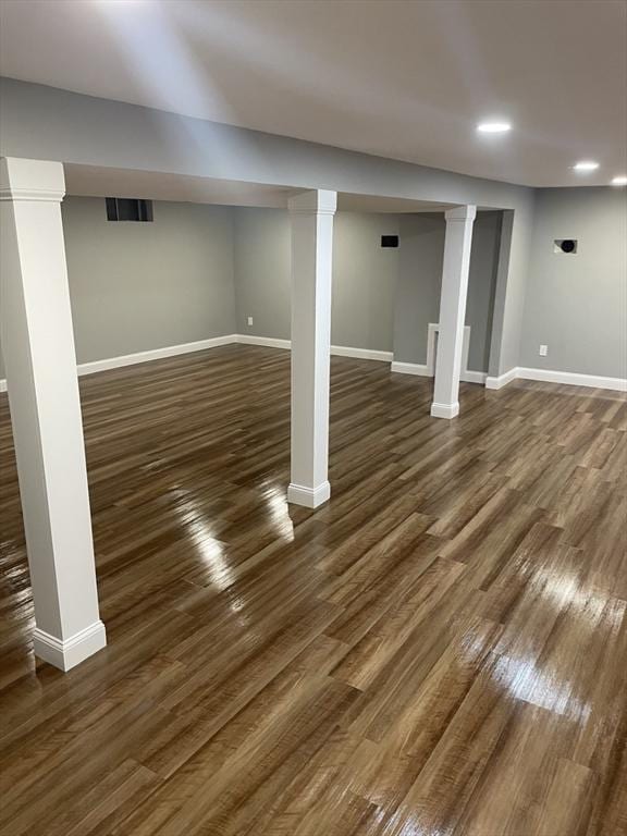 47 Woodcock Ln, Marlborough, MA 01752 - finished below grade area with baseboards, dark wood finished floors, and recessed lighting