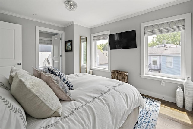 3 Ardee St Unit 3, Boston, MA 02128 - bedroom featuring baseboards, crown molding, and wood finished floors