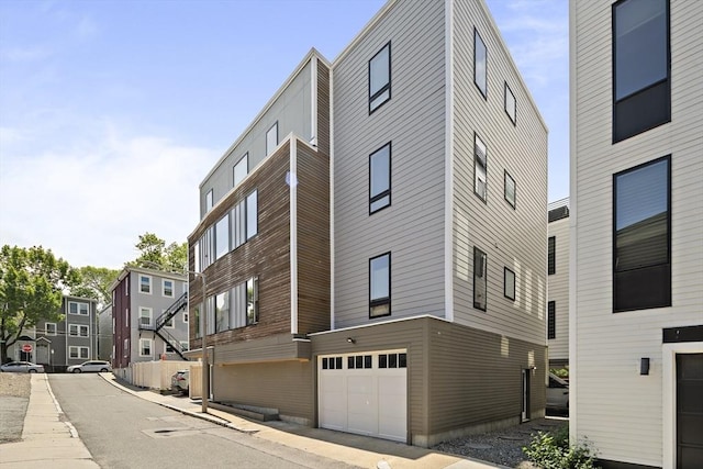 3 Ardee St Unit 3, Boston, MA 02128 - view of building exterior with an attached garage