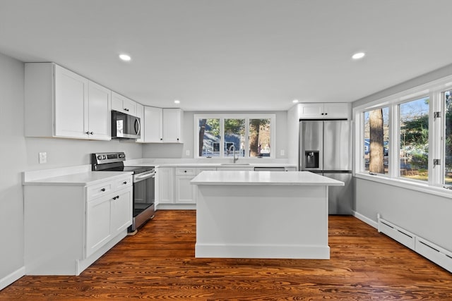 kitchen featuring white cabinetry, sink, a healthy amount of sunlight, and appliances with stainless steel finishes