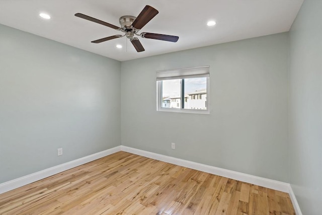 empty room featuring ceiling fan and light wood-type flooring