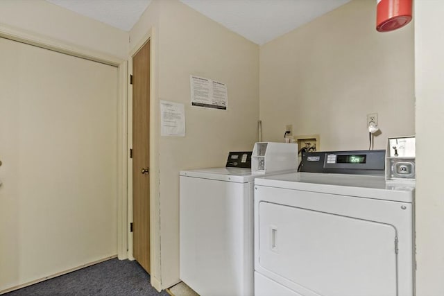 laundry room with carpet flooring and washing machine and dryer