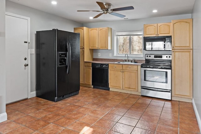 kitchen with sink, light brown cabinetry, and black appliances