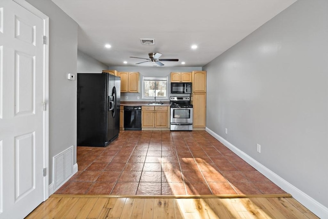 kitchen with sink, ceiling fan, wood-type flooring, black appliances, and light brown cabinetry