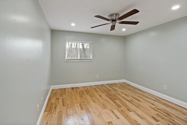 spare room featuring ceiling fan and light hardwood / wood-style flooring