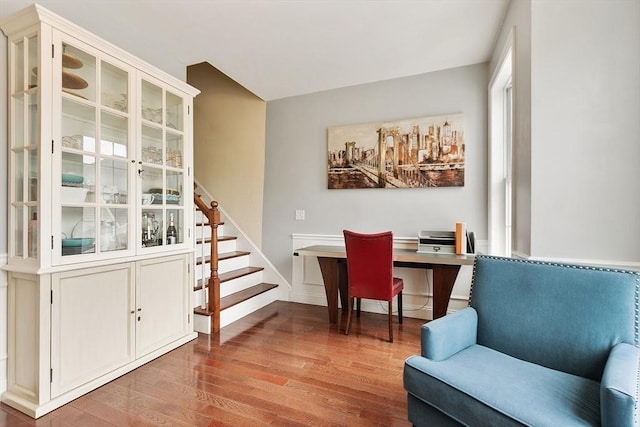 home office featuring baseboards and light wood-type flooring