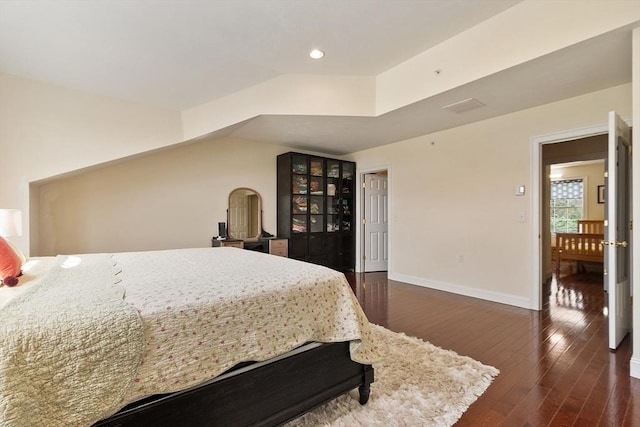 bedroom with baseboards, dark wood finished floors, and recessed lighting