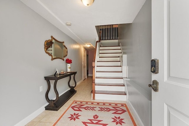 interior space featuring tile patterned flooring and baseboards