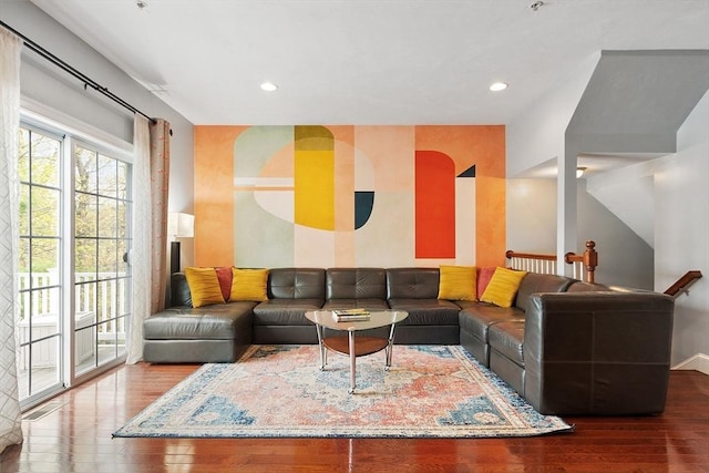 living room featuring recessed lighting, baseboards, and wood finished floors