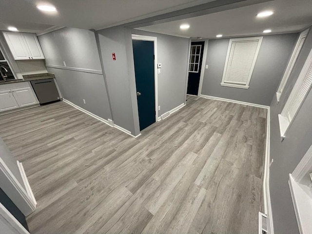 7 Coolidge St, Hudson, MA 01749 - finished basement featuring light wood-type flooring, baseboards, recessed lighting, and a sink