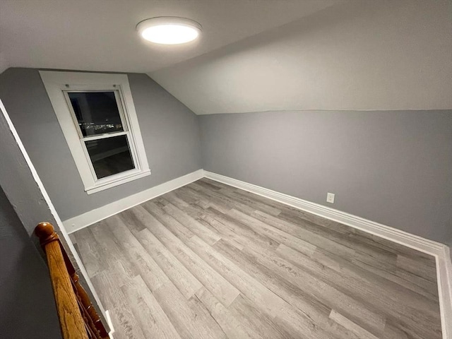 7 Coolidge St, Hudson, MA 01749 - additional living space with wood finished floors, lofted ceiling, and baseboards