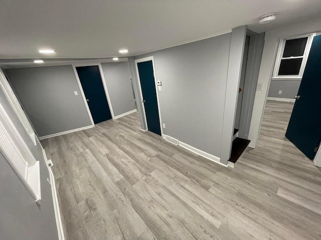 7 Coolidge St, Hudson, MA 01749 - empty room featuring light wood-style flooring, baseboards, recessed lighting, and a smoke detector