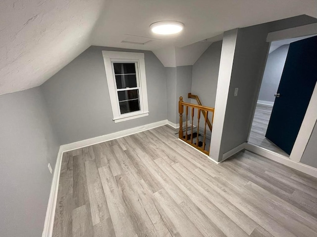 7 Coolidge St, Hudson, MA 01749 - bonus room with wood finished floors, baseboards, and vaulted ceiling