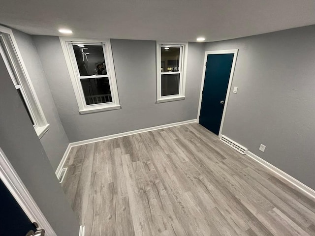 7 Coolidge St, Hudson, MA 01749 - empty room with wood finished floors, baseboards, and recessed lighting