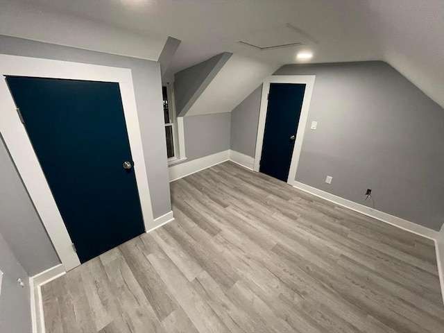 7 Coolidge St, Hudson, MA 01749 - bonus room with wood finished floors, lofted ceiling, and baseboards