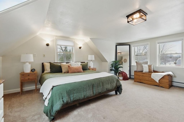 bedroom featuring multiple windows, vaulted ceiling, and light carpet