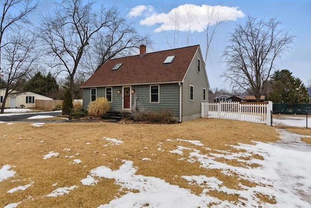 view of front of house with a shingled roof, a chimney, and fence