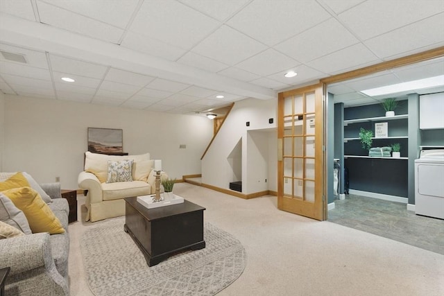 carpeted living area with recessed lighting, visible vents, stairway, washer / dryer, and baseboards