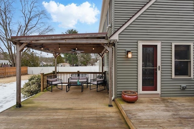 wooden terrace featuring a fenced backyard and ceiling fan