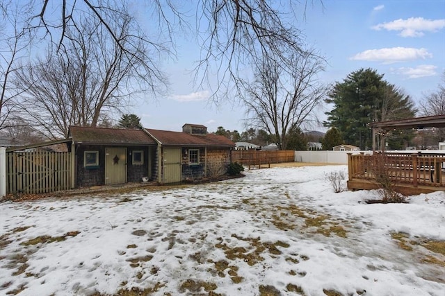 exterior space featuring fence and a deck