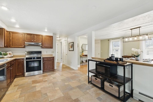 kitchen with stainless steel appliances, light countertops, baseboard heating, under cabinet range hood, and baseboards