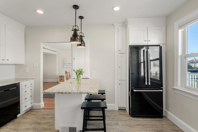 75 Puritan Rd Unit B, Swampscott, MA 01907 - kitchen with black appliances, white cabinets, healthy amount of natural light, light wood finished floors, and recessed lighting