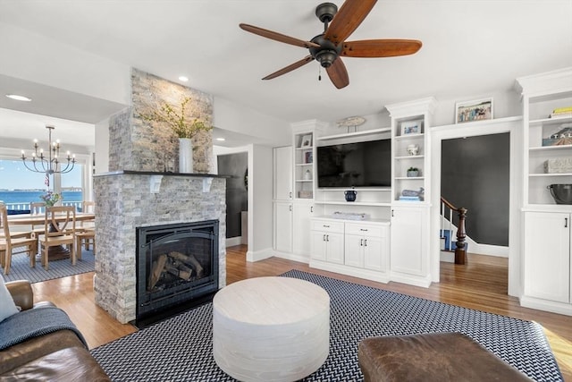 75 Puritan Rd Unit B, Swampscott, MA 01907 - living room featuring wood finished floors, a ceiling fan, and a stone fireplace