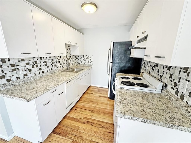 kitchen with white cabinets, a sink, light wood-type flooring, white appliances, and under cabinet range hood