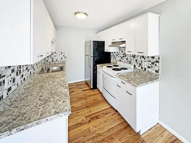 kitchen with light wood finished floors, electric stove, light countertops, under cabinet range hood, and a sink