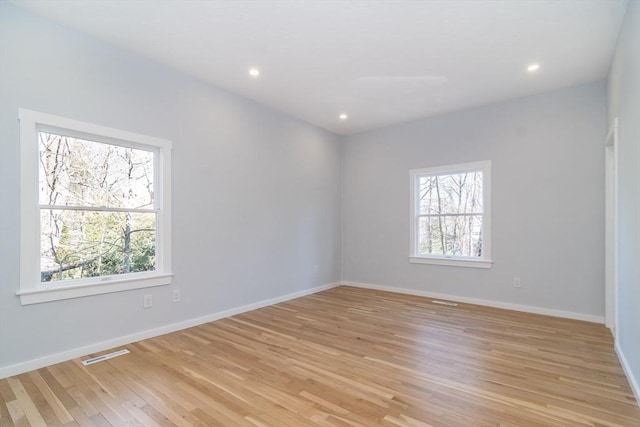 unfurnished room featuring light wood-type flooring