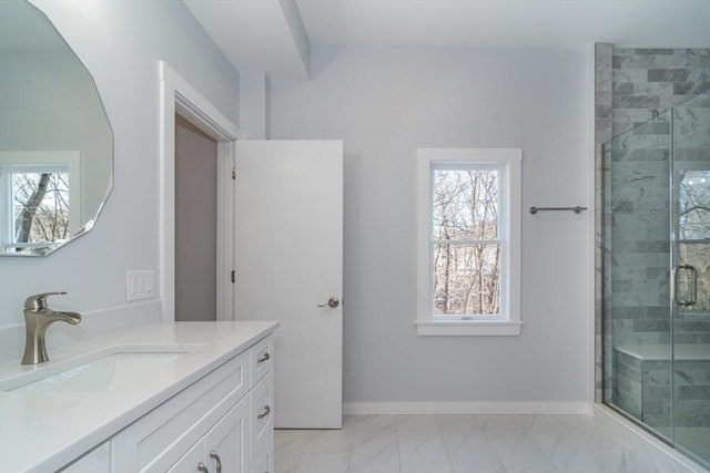 bathroom featuring walk in shower and vanity