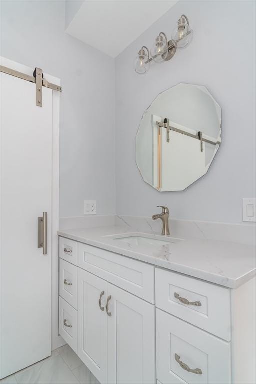 bathroom with tile patterned floors and vanity