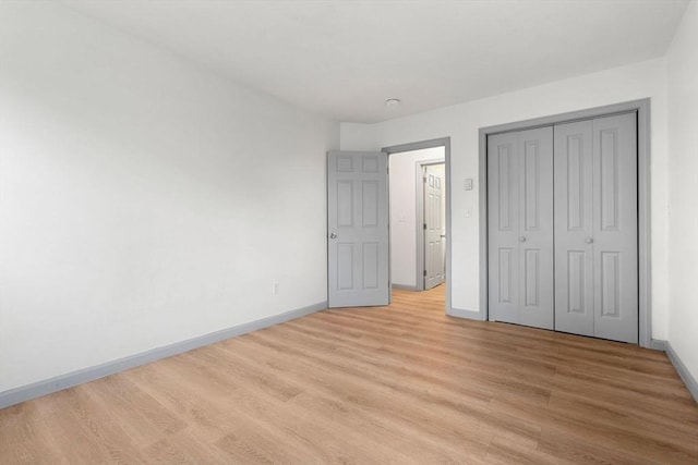 8 Lafayette Park Unit 9, Lynn, MA 01902 - unfurnished bedroom featuring light wood-style floors and a closet