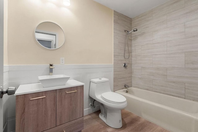 8 Lafayette Park Unit 9, Lynn, MA 01902 - bathroom with vanity, shower / bath combination, wainscoting, wood finished floors, and a decorative wall