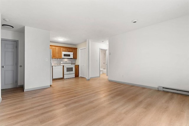 8 Lafayette Park Unit 9, Lynn, MA 01902 - unfurnished living room with light wood-style floors and a baseboard heating unit