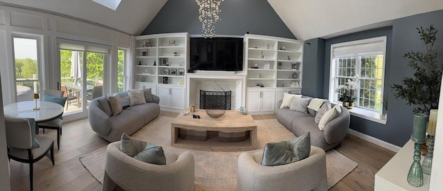 5 Cortland Dr, Hudson, MA 01749 - living room with vaulted ceiling, wood finished floors, a fireplace, and baseboards