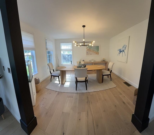 5 Cortland Dr, Hudson, MA 01749 - dining area with a chandelier, healthy amount of natural light, light wood-type flooring, and baseboards