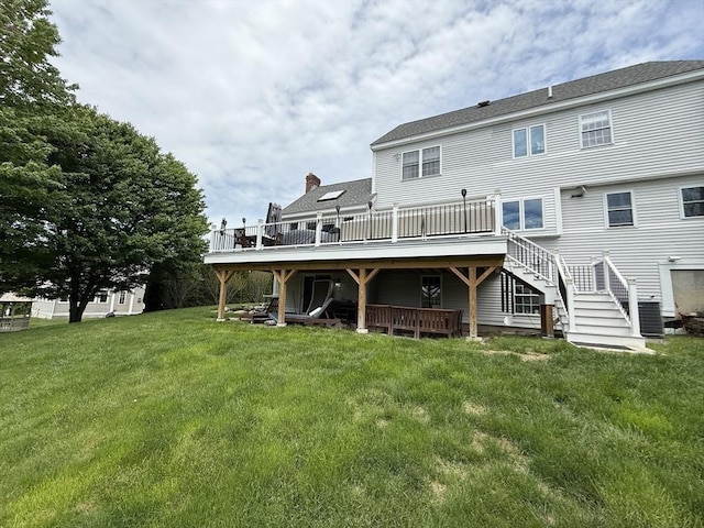 5 Cortland Dr, Hudson, MA 01749 - rear view of property featuring a deck, stairway, and a lawn