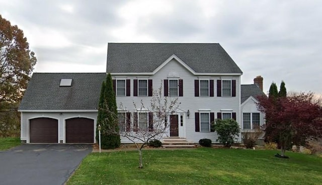 5 Cortland Dr, Hudson, MA 01749 - colonial-style house featuring driveway, a garage, a front lawn, and roof with shingles