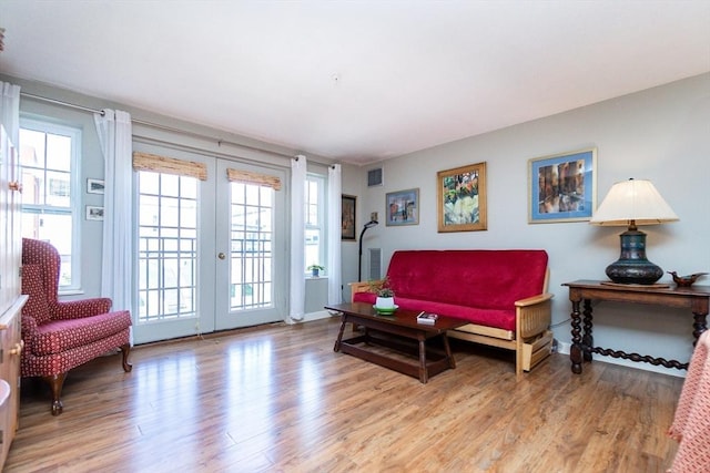 11 Church Unit 313, Salem, MA 01970 - sitting room with light wood-style flooring, french doors, and baseboards