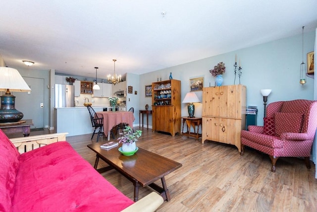 11 Church Unit 313, Salem, MA 01970 - living room with a chandelier and light wood-type flooring