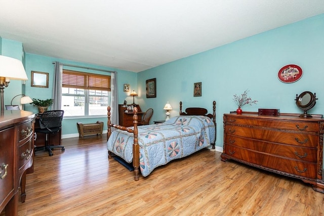 11 Church Unit 313, Salem, MA 01970 - bedroom with wood finished floors, baseboards, and a desk