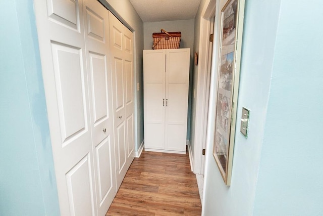 11 Church Unit 313, Salem, MA 01970 - hallway featuring light wood finished floors