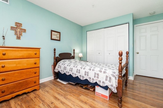 11 Church Unit 313, Salem, MA 01970 - bedroom featuring wood finished floors, a closet, and baseboards