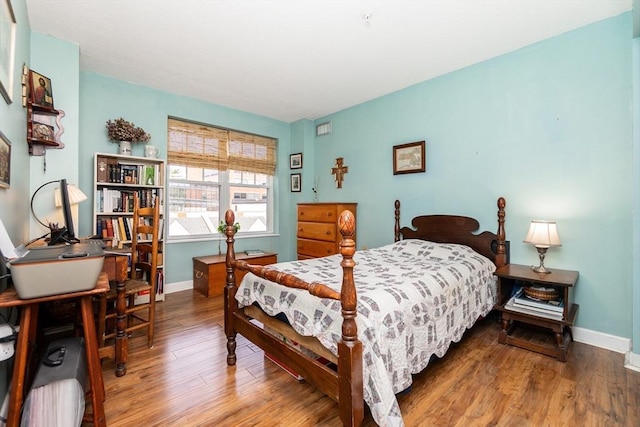 11 Church Unit 313, Salem, MA 01970 - bedroom with wood finished floors, baseboards, and an office area