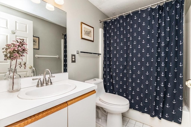 11 Church Unit 313, Salem, MA 01970 - bathroom with vanity, toilet, tile patterned floors, and a textured ceiling